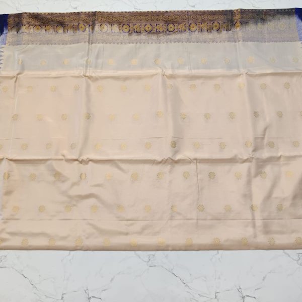 Traditional Cream Silk Saree with Gold Floral Motifs, Navy Blue Border, Zari Work